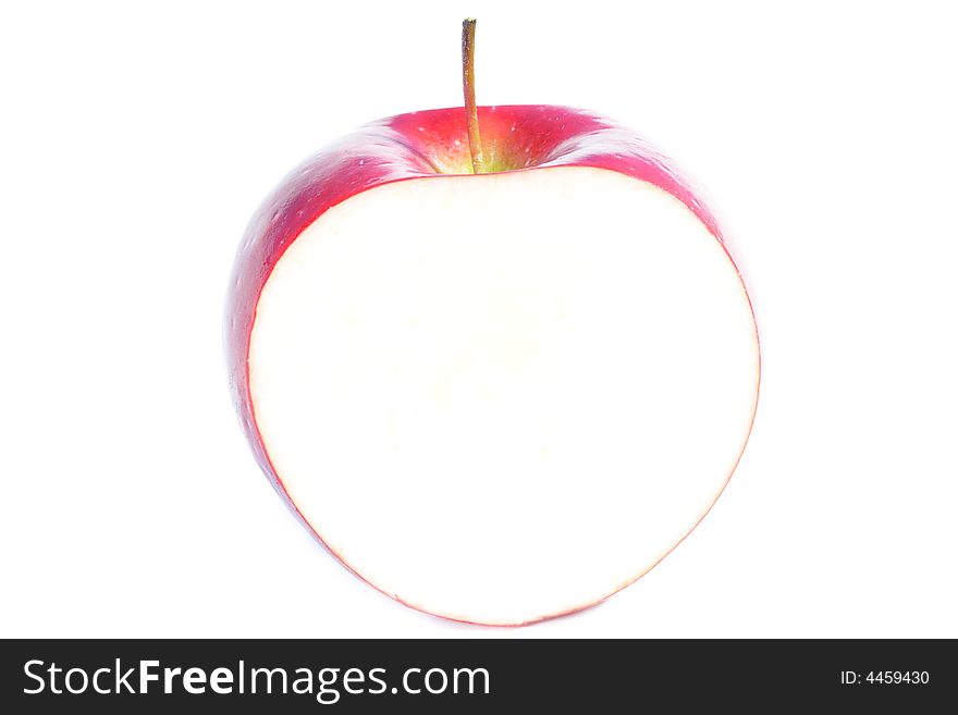 Center inch section of a red apple. White background for copyspace. Center inch section of a red apple. White background for copyspace