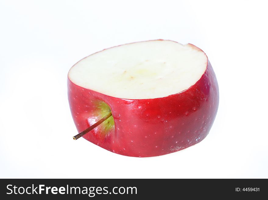 Center inch section of a red apple. White background for copyspace. Center inch section of a red apple. White background for copyspace