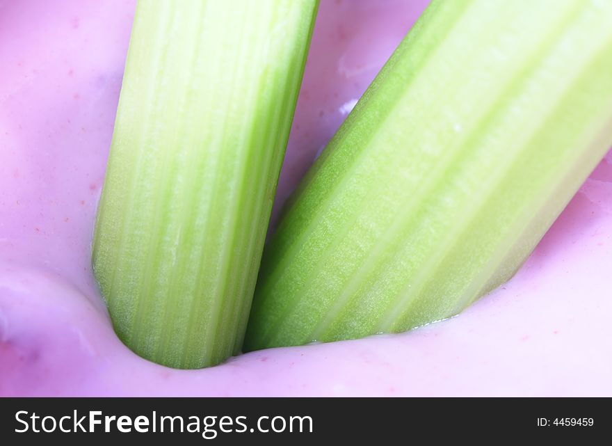 Celery Dipped in yogurt making a healthy snack