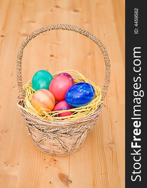 Easter basket on a wooden table. Easter basket on a wooden table.