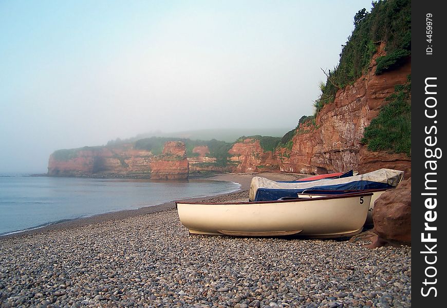 Boats in cove (beach) on a sunny day.