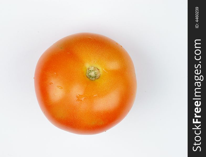 Tomato close up with water droplet on it