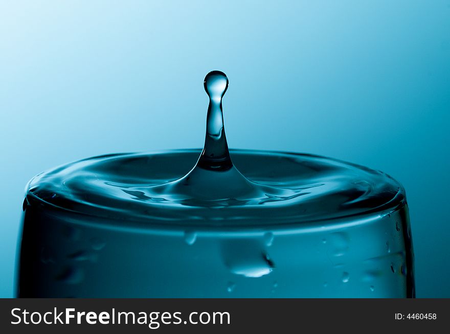 Glass of pure water in a blue tone. Glass of pure water in a blue tone