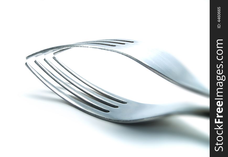 Two forks on a white background