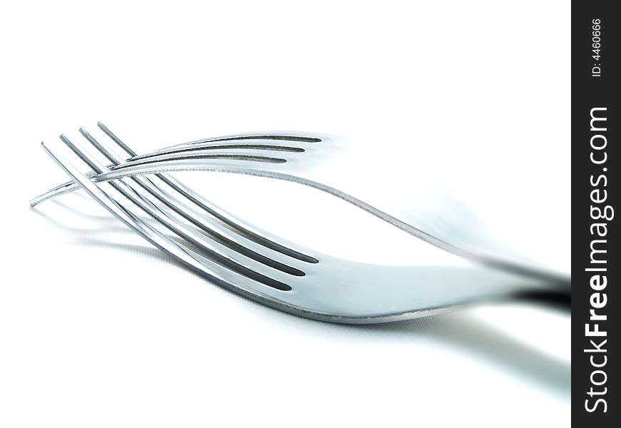 Two forks on a white background