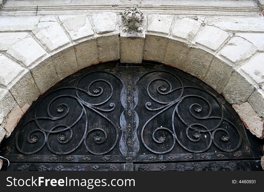 Old gate with a stone arch