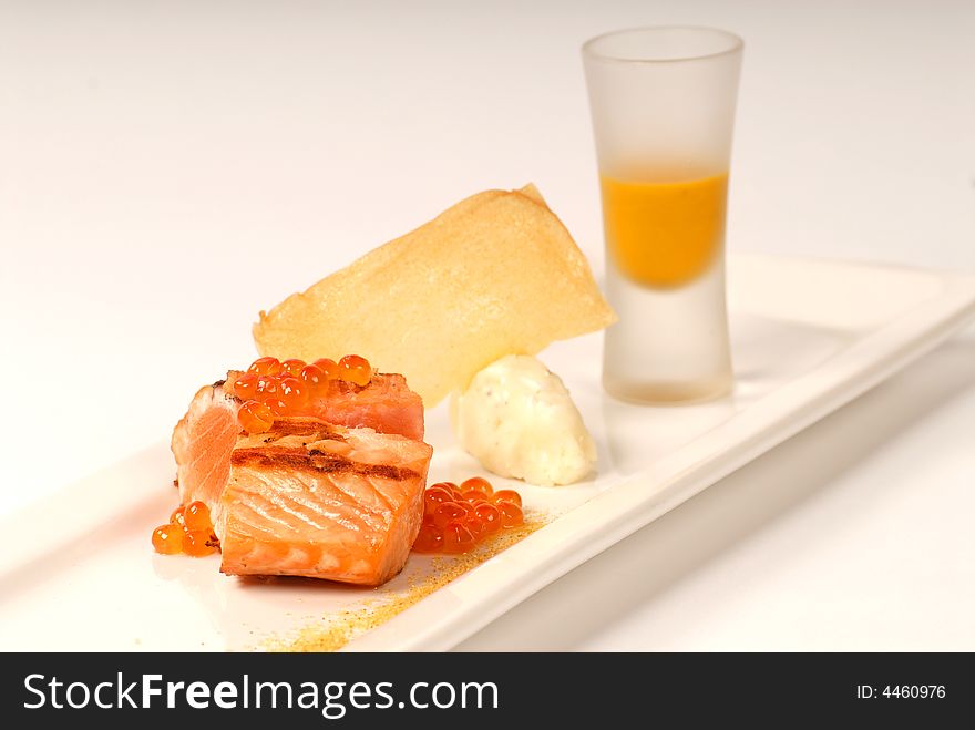 Asian seared salmon with caviar and pumpkin soup