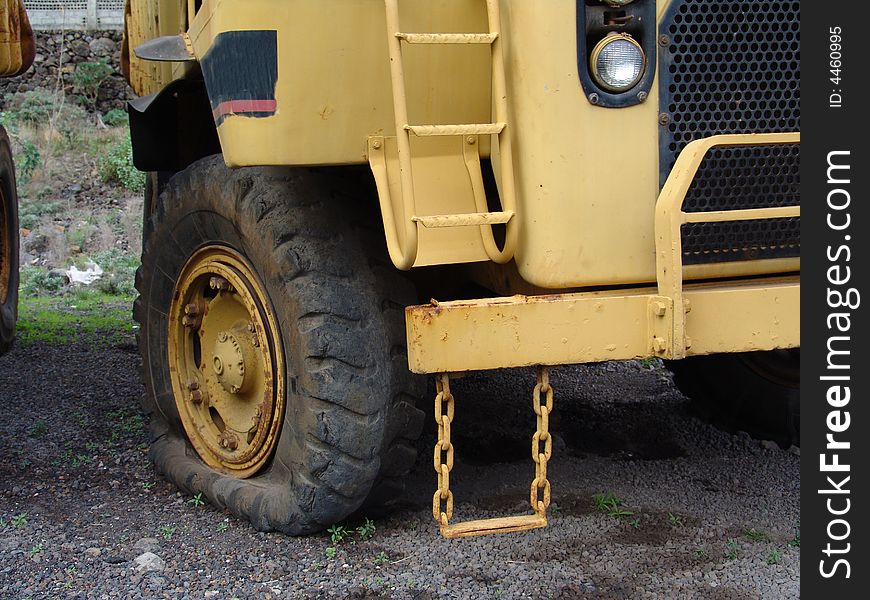 A detail view of an olderr caterpillar truck. A detail view of an olderr caterpillar truck.