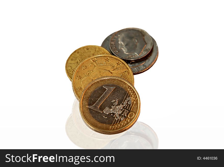 Several euro and U.S.A. coins with mirror reflection isolated. Several euro and U.S.A. coins with mirror reflection isolated