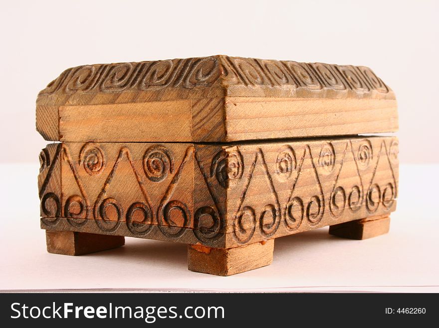 Wooden jewellery casket over white background