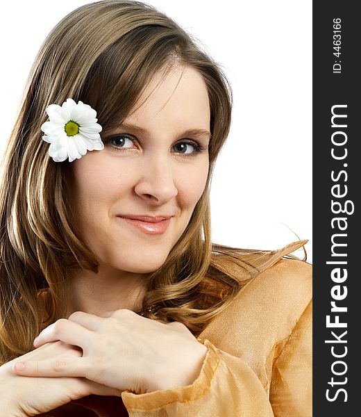 Smiling girl with daisy at hair on white background. Smiling girl with daisy at hair on white background