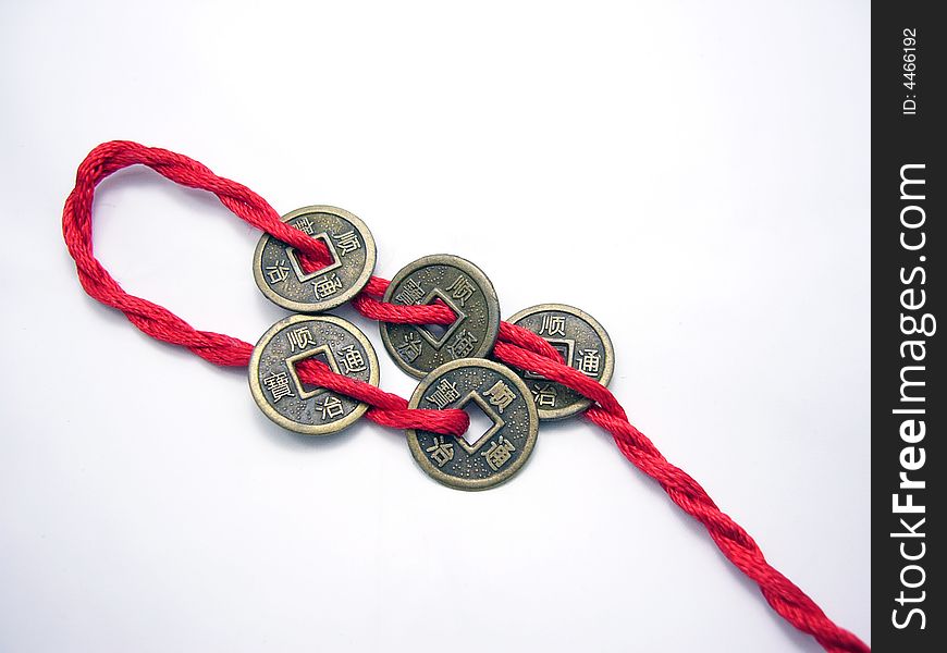 Five chinese ancient coins chained with red cord