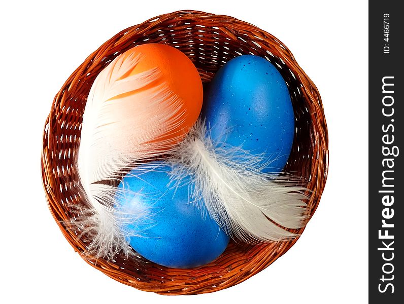 Easter eggs on wicker basket