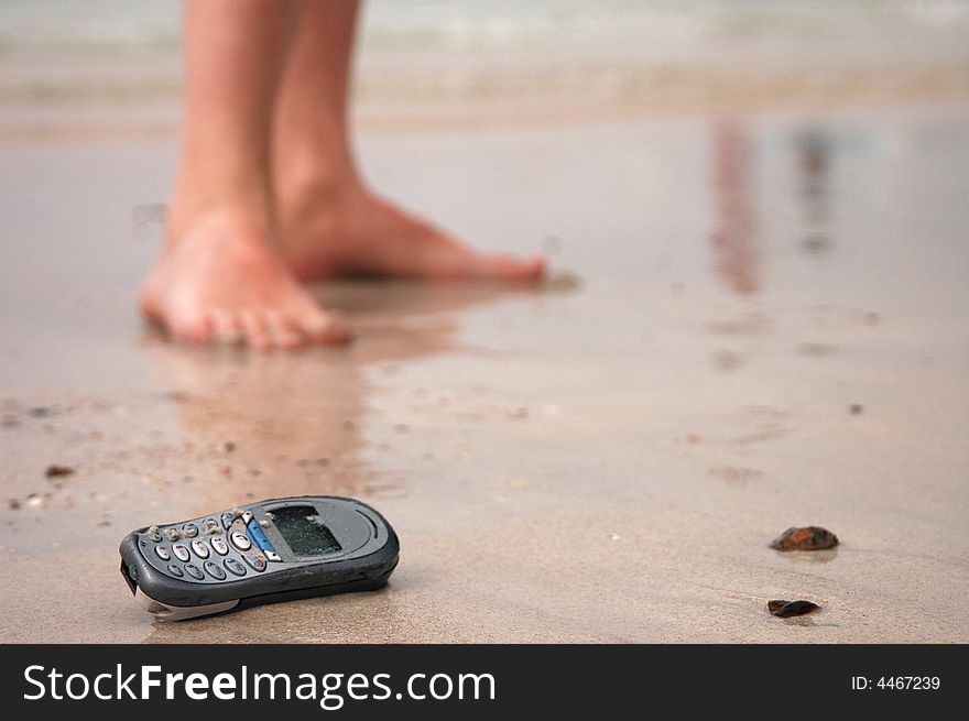 Cellphone in the beach. sand