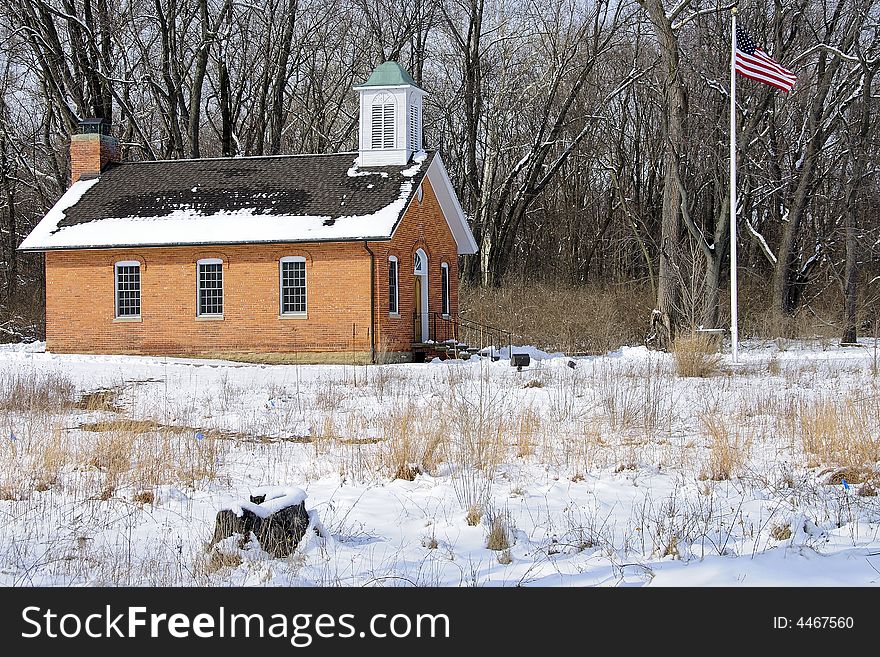 Restored red brick schoolhouse symbolic of basic and classic American education