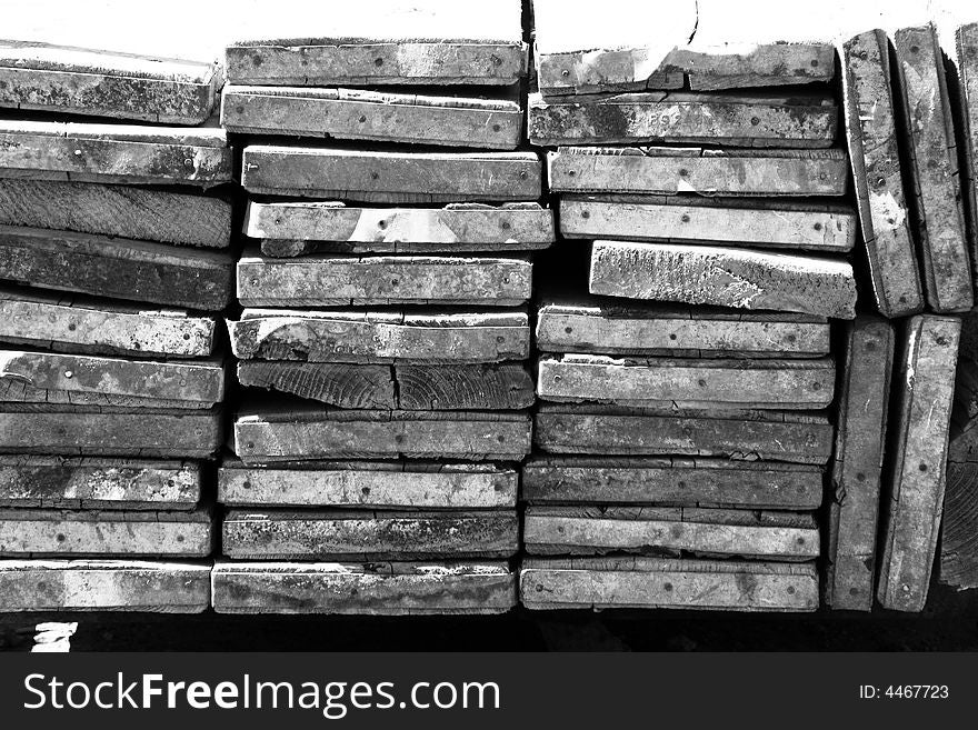A stack of construction planks used for scaffold looking end on. A stack of construction planks used for scaffold looking end on