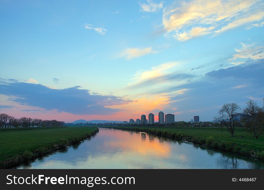 Skyscrapers reflection in river at sunset in Zagreb, Croatia. Skyscrapers reflection in river at sunset in Zagreb, Croatia