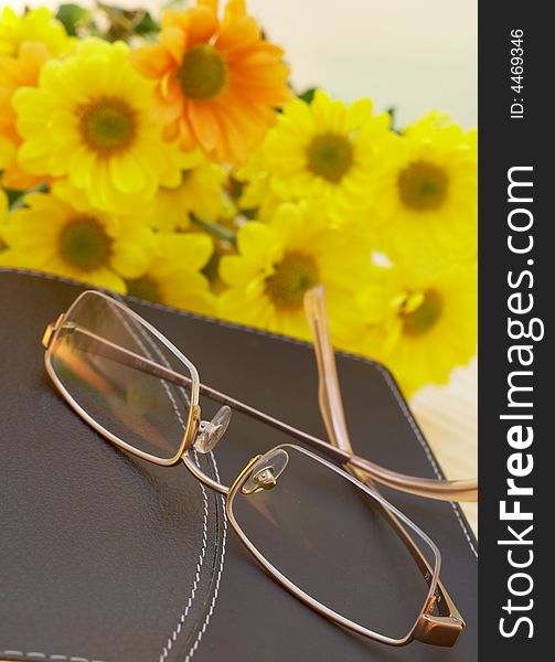 Bible with flowers and reading glasses