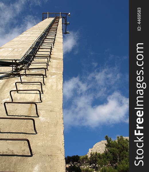 Rusty stairs on the wall stretching up. Rusty stairs on the wall stretching up