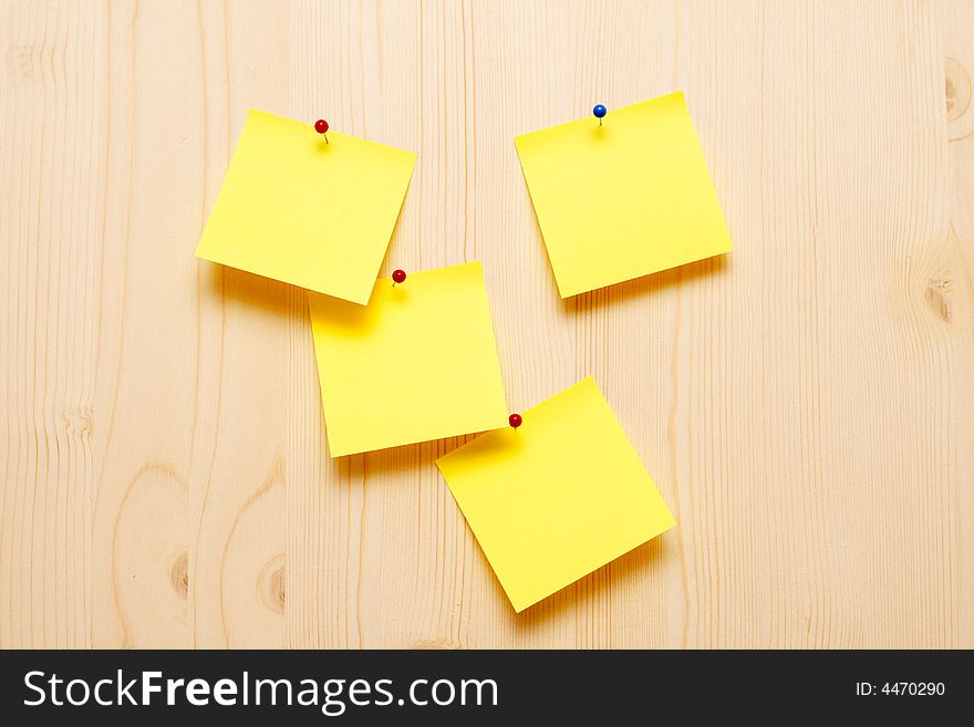 Yellow sticky notes on wooden background. Yellow sticky notes on wooden background