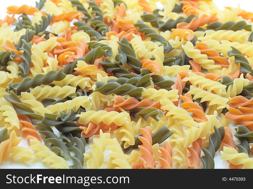 Green, yellow and red spiral italian pasta. Green, yellow and red spiral italian pasta