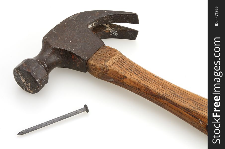 Old vintage hammer and nail for home construction