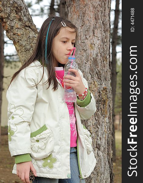 Little girl drinking mineral water. Little girl drinking mineral water