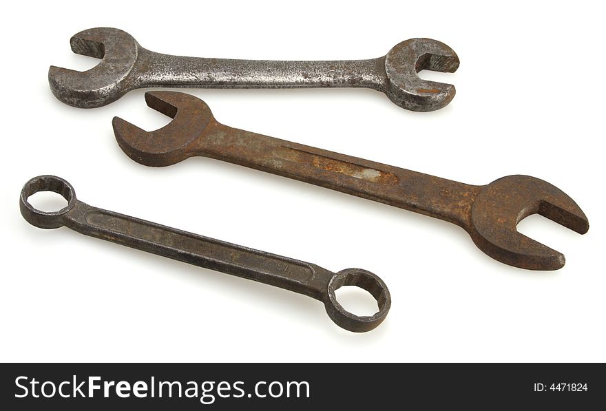 Three old vintage open end and box end wrenches. Three old vintage open end and box end wrenches