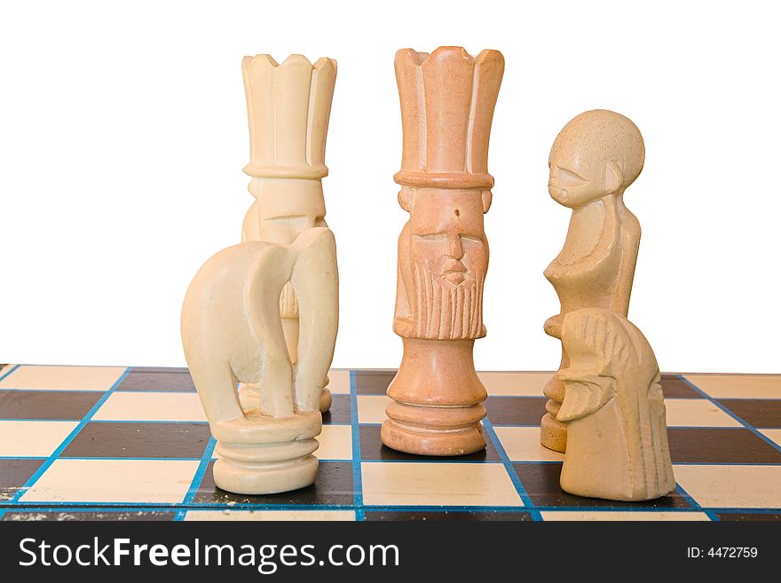 A king surroundered on the chess board, all pieces made from soapstone.