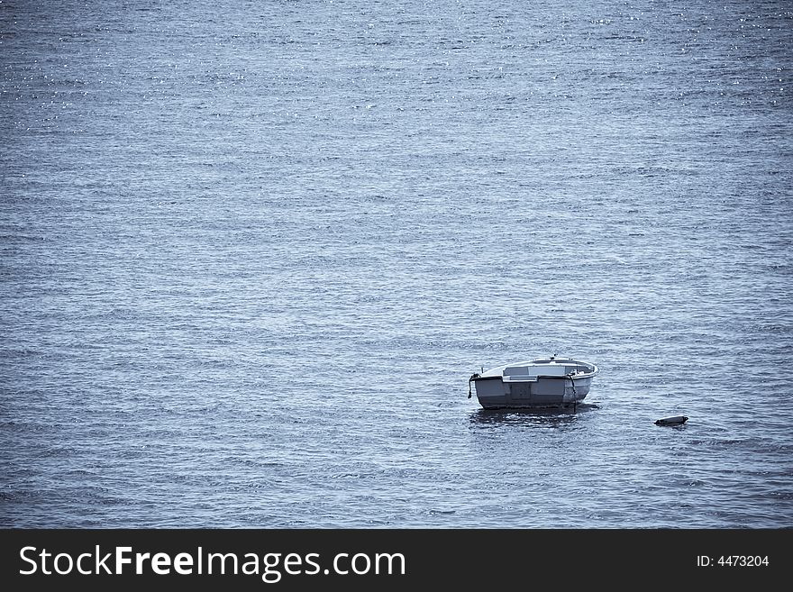 Lone boat at the sea