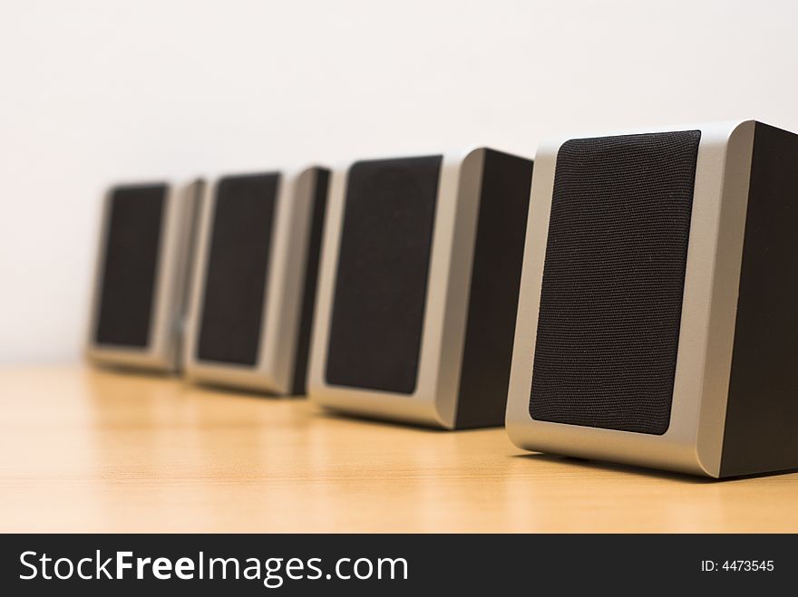 Sound speakers aligned on table