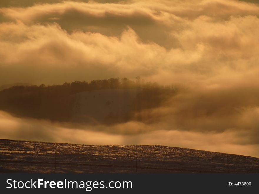 Cloudy sunset in the mountains in winter