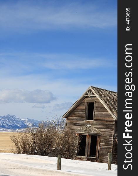 An old abandoned farm house with a great view of the Rocky Mountains. An old abandoned farm house with a great view of the Rocky Mountains