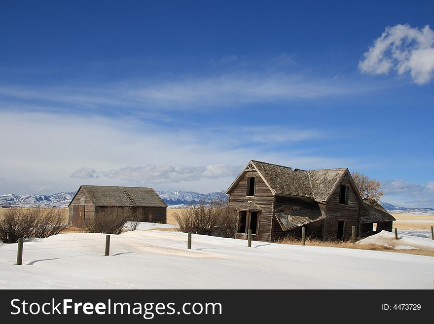 An old abandoned farm house with a great view of the Rocky Mountains. An old abandoned farm house with a great view of the Rocky Mountains