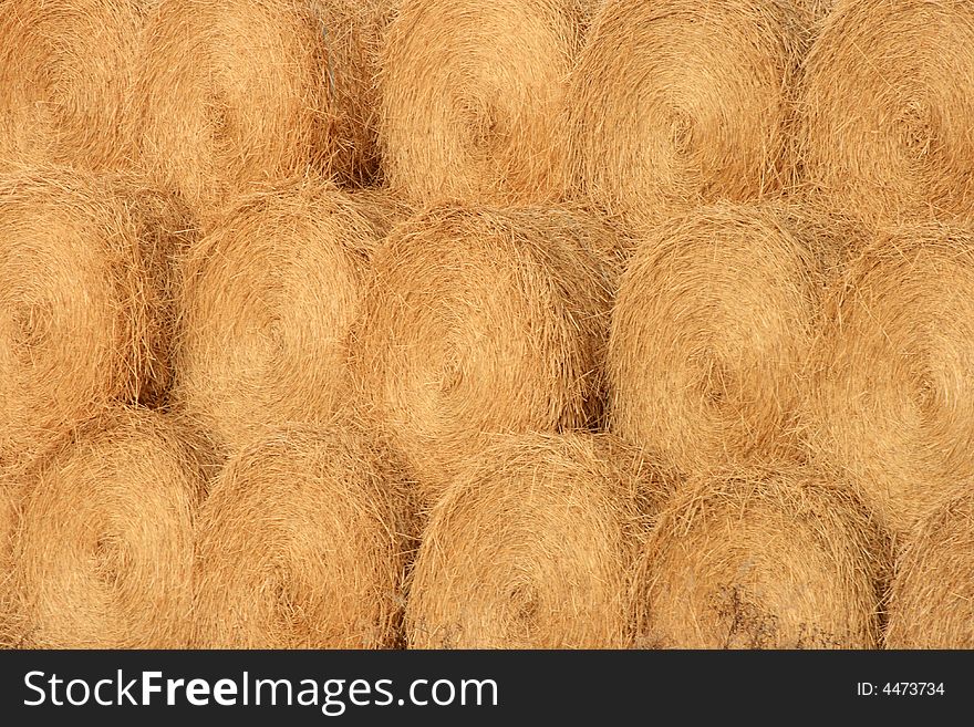 Abstract detail of a large pile of round bales