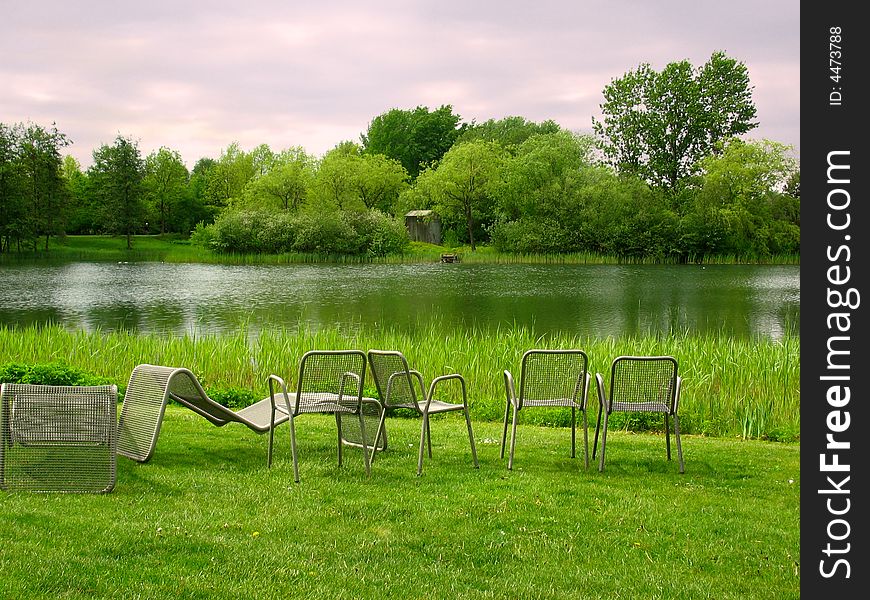 Chairs In Park Overlooking The Lake