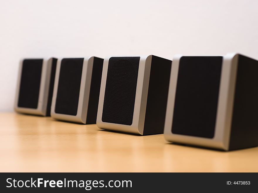 Sound speakers aligned on table