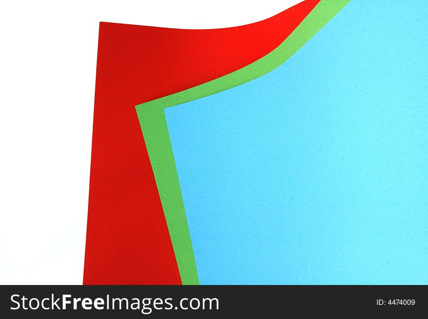 Three different colored pieces of paper. red green and blue. isolated on a white background. Three different colored pieces of paper. red green and blue. isolated on a white background