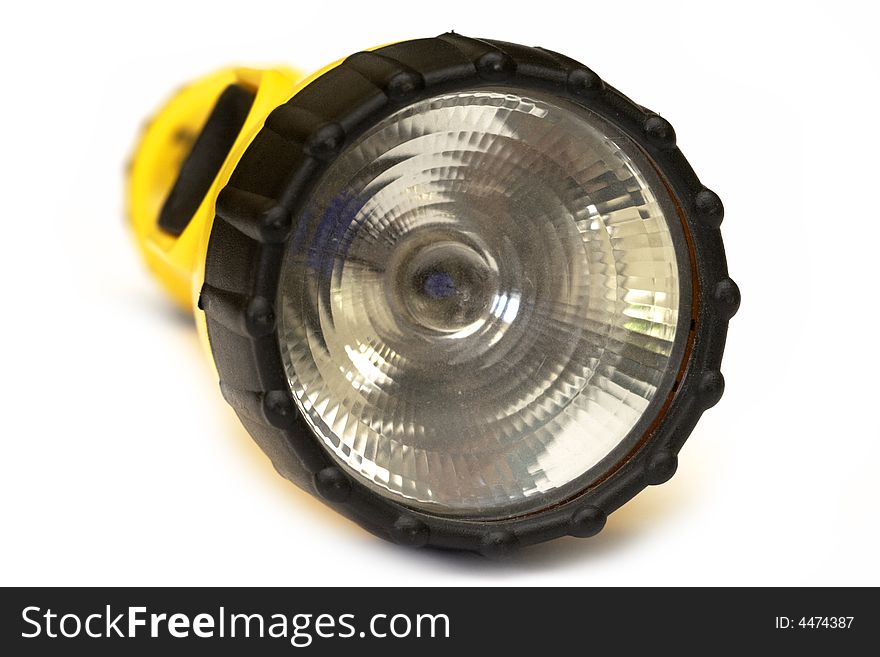 Yellow and black flashlight with white background