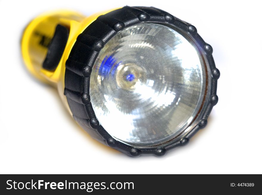 Yellow and black flashlight with white background