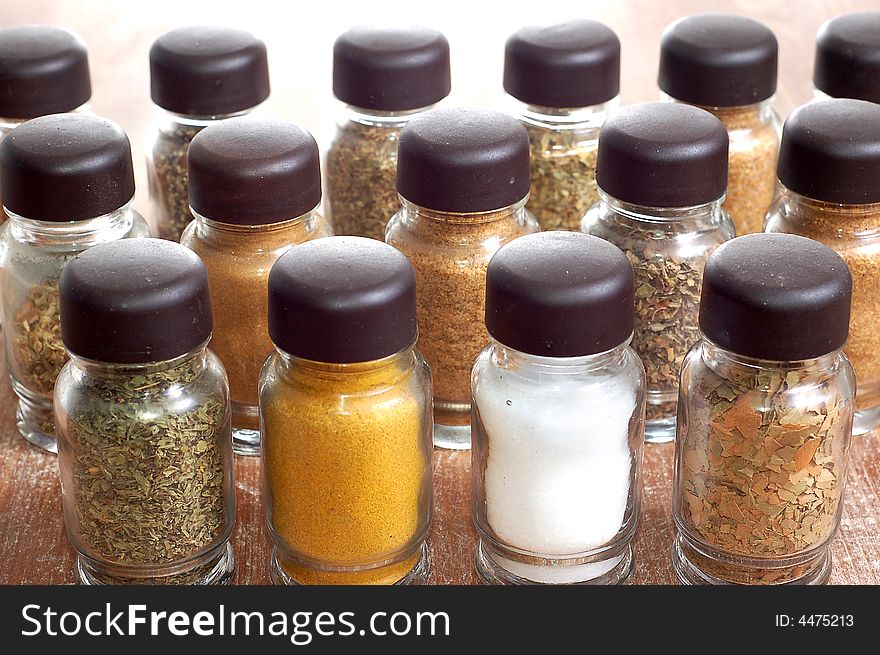 Variety of spices in bottles high resolution image