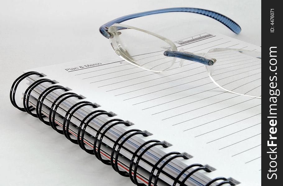 Glasses and a notepad