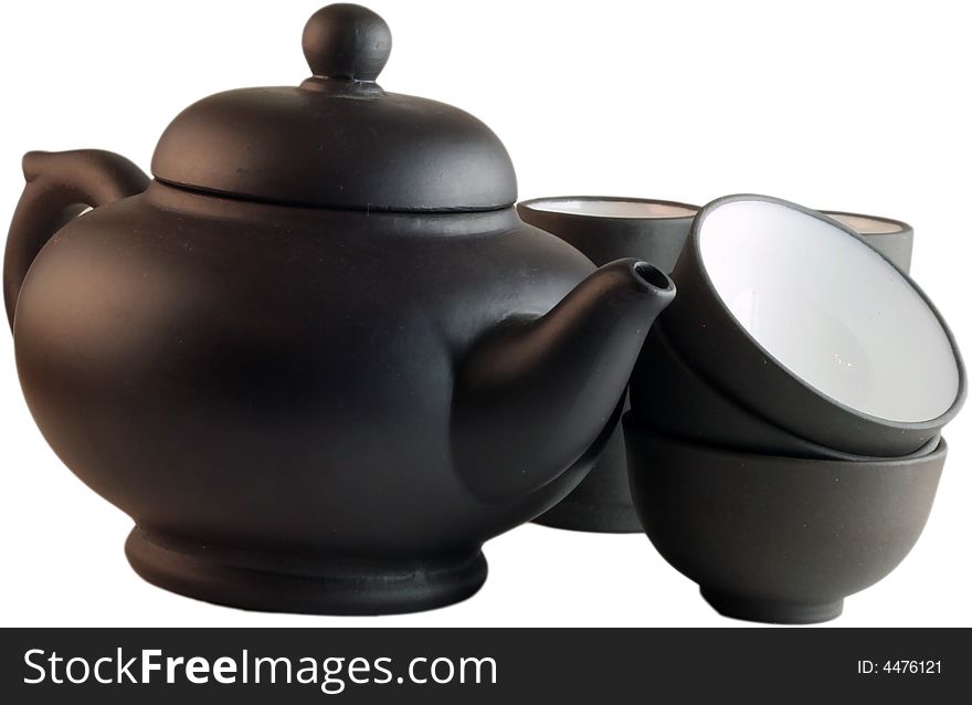 Isolated black teapot and the cups against a white background. Isolated black teapot and the cups against a white background