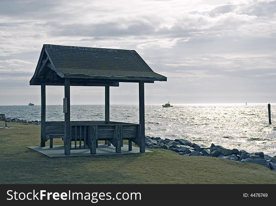 A shelter on the coast with stormy seas and sky. A shelter on the coast with stormy seas and sky