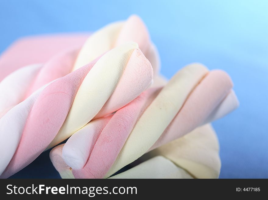 Large Marshmallows against blue background