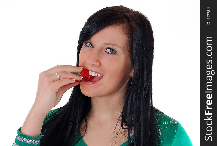 A girl eating a strawberry high resolution