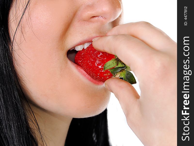 A Girl Eating A Strawberry