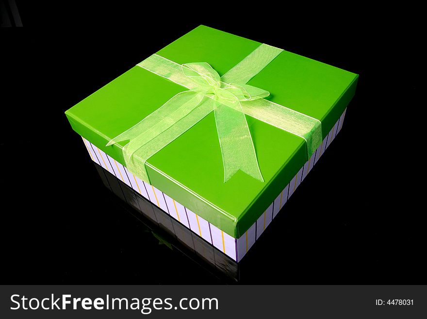 A green gift box with big tie. A green gift box with big tie