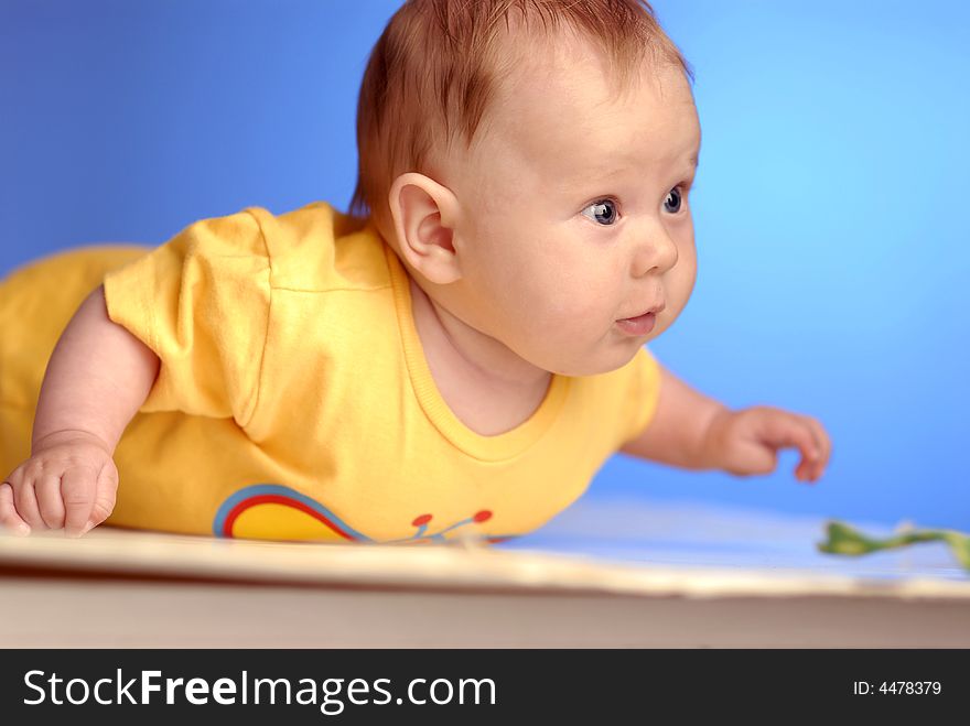 A baby in yellow on exploration