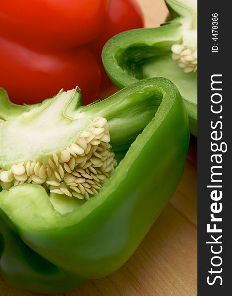 Macro Shot of Cut Fresh Bell Pepper on a wood Cutting Board. Macro Shot of Cut Fresh Bell Pepper on a wood Cutting Board